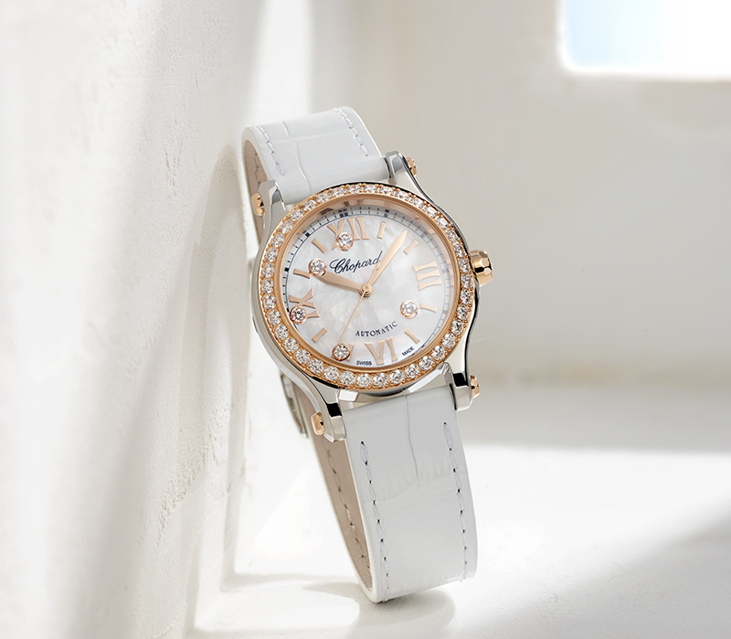 Часы Chopard Happy Sport в 30 мм корпусе из розового золота с бриллиантами по безелю и 5 «плавающими» бриллиантами
