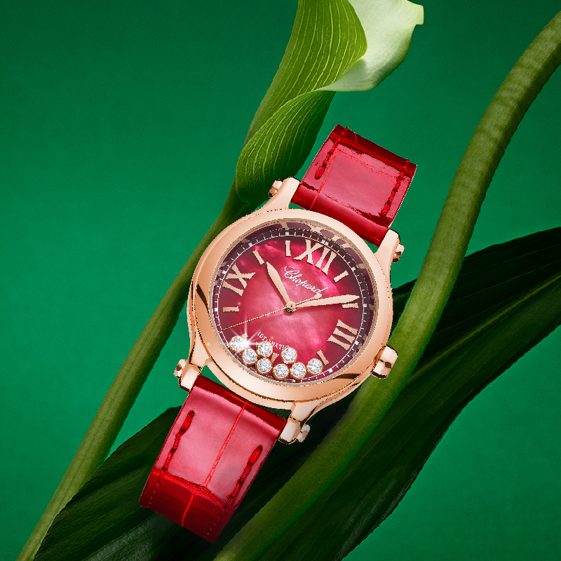 Часы Chopard Happy Sport в 33 мм корпусе из розового золота с 8 плавающими бриллиантами и рубином на заводной головке