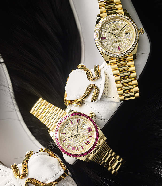 Часы Rolex Oyster Day-Date в корпусе из желтого золота с бриллиантами и рубинами и часы Rolex Oyster Day-Date в корпусе из желтого золота с бриллиантами